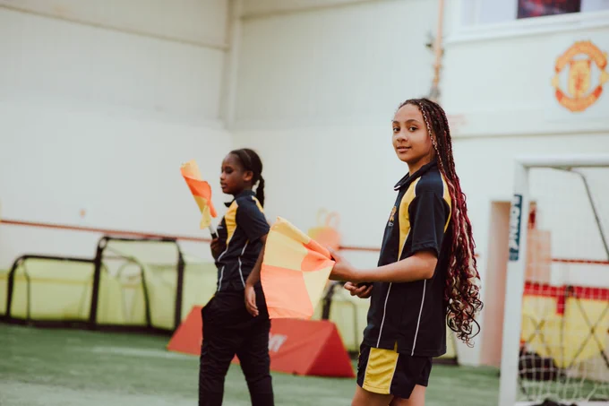 Girls play football at the Cliff Training Ground