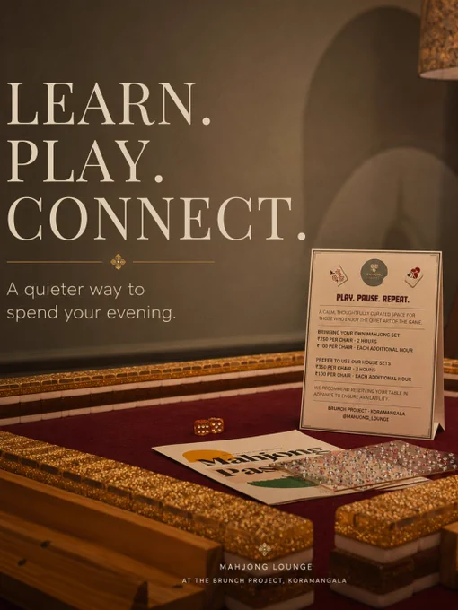 A warm editorial-style promotional image for Mahjong Lounge at The Brunch Project in Koramangala, Bangalore. The first image features four women gathered around a Mahjong table in a softly lit room with muted green walls, framed Mahjong-inspired artwork, and a cozy floor lamp creating an intimate evening atmosphere. Elegant serif typography reads, “Whether you’re learning your first hand or playing your hundredth round, the table always has room for one more.” The second image showcases a close-up of a Mahjong table with decorative gold-edged tiles, warm ambient lighting, and signage describing Mahjong Lounge as a calm, thoughtfully curated space to learn, play, and connect. Text highlights beginner-friendly sessions, open play, and community-focused experiences. The overall visual style feels luxurious, welcoming, calm, and community-driven, emphasizing Mahjong Lounge as a mindful offline social experience in Bangalore.
