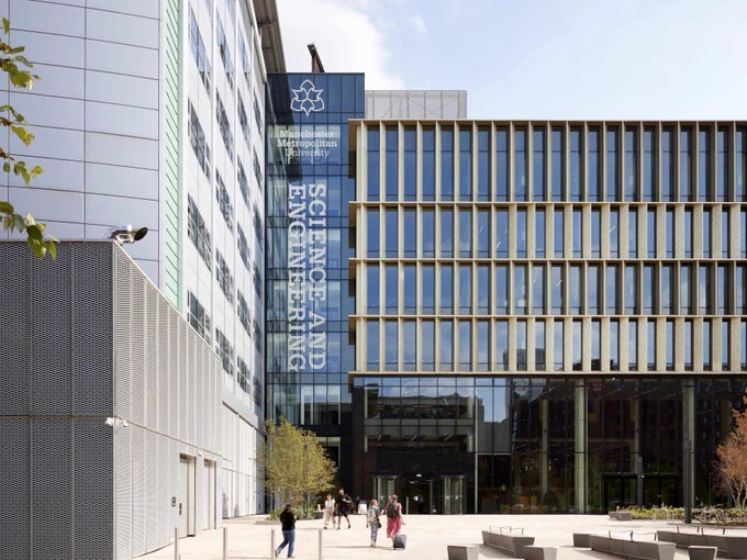 The exterior of The Dalton Building, featuring various glass elements. The Manchester Met logo is visible on the building, as is the text "Science and Engineering".