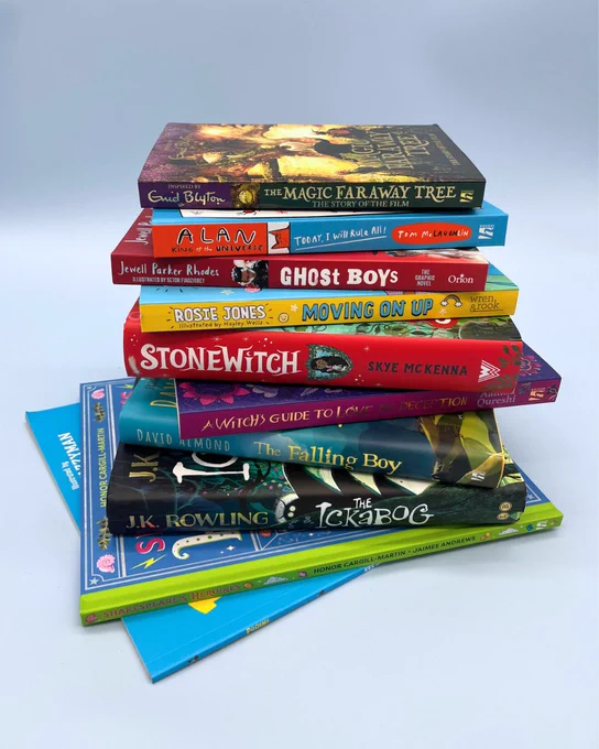 Stack of ten books: Pooems, Shakespeare's Heroines, The Ickabog, The Falling Boy, A Witch's Guide to Love and Deception, Stonewitch, Moving on Up, Ghost Boys, Alan King of the Universe, The Magic Faraway Tree Novelisation, on a pale blue background 