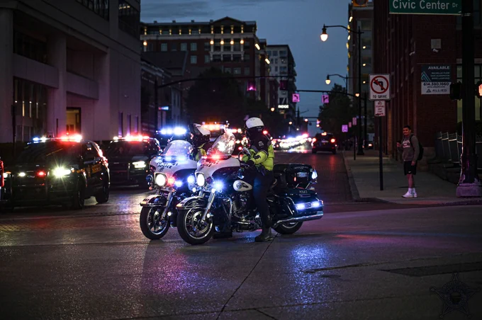 police cars downtown columbus at night with motorcycles