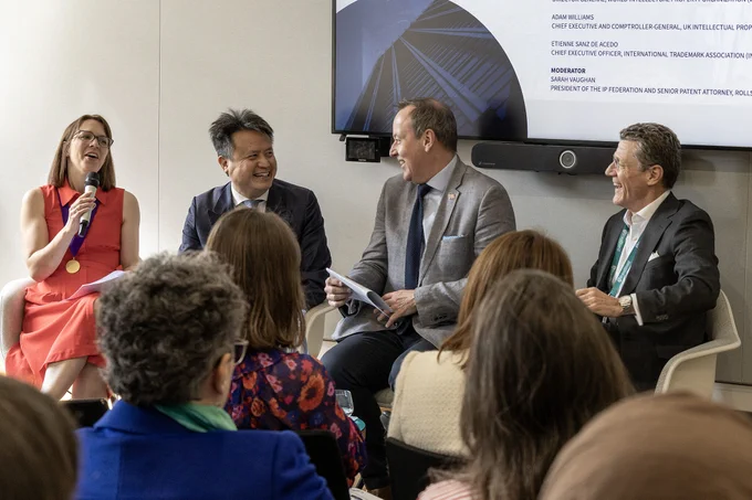 An image of the panel smiling and laughing together. 