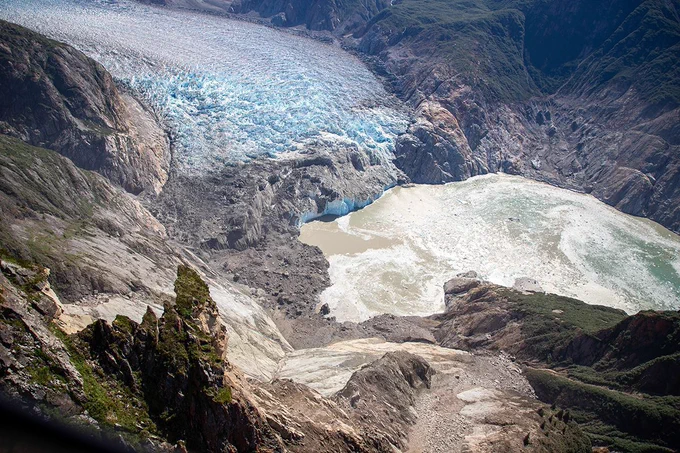 Oblique aerial photo of the landslide and the highest run-up resulting from the landslide-triggered tsunami in Tracy Arm during a U.S. Geological Survey field reconnaissance overflight. View direction is approximately south. Photo by John Lyons/U.S. Geological Survey.