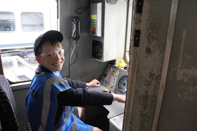 A student sits in the cab of 507001 at Litchurch Lane works.
