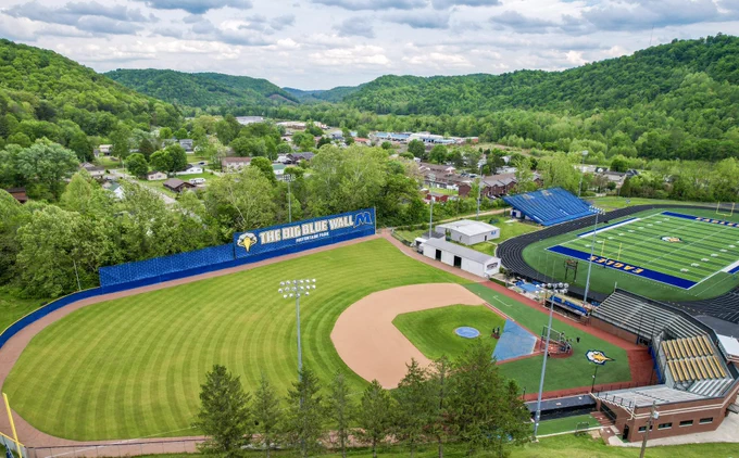Aerial shot of MSU’s athletic portion campus showing off Sonny Allen Baseball Field and Phil Simms Stadium / Jacobs Field surrounded by the lush, green mountains of the Daniel Boone Natl Forest