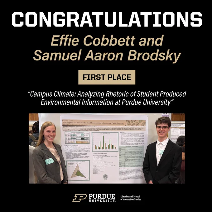 A student, Effie, on the left in a brown suit jacket and a student, Samuel,  in a black suit jacket to the right of their poster