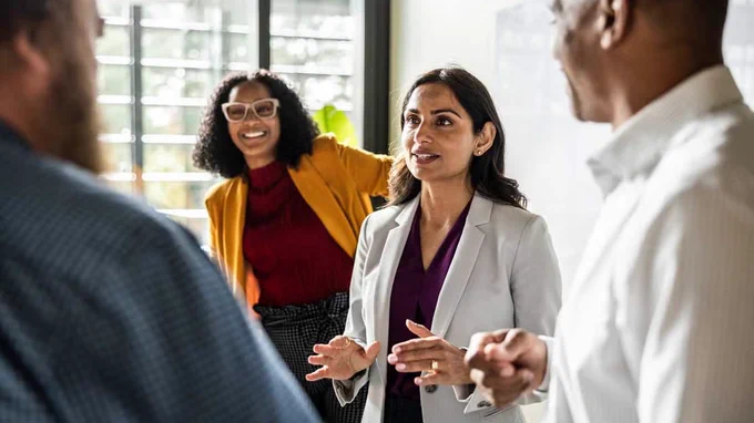 Businessperson with colleagues in modern conference room