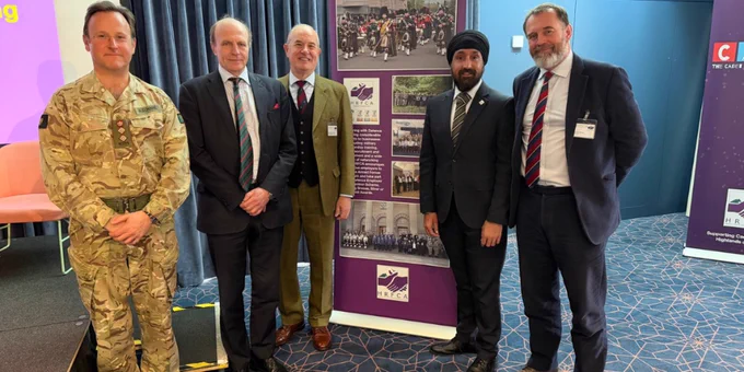 51 Infantry Brigade and Headquarters Scotland Assistant Commander, Council of RFCAs Chief Executive, Highland RFCA Chair, Scottish Chambers of Commerce Chief Executive, and Highland RFCA Chief Executive standing and smiling together.