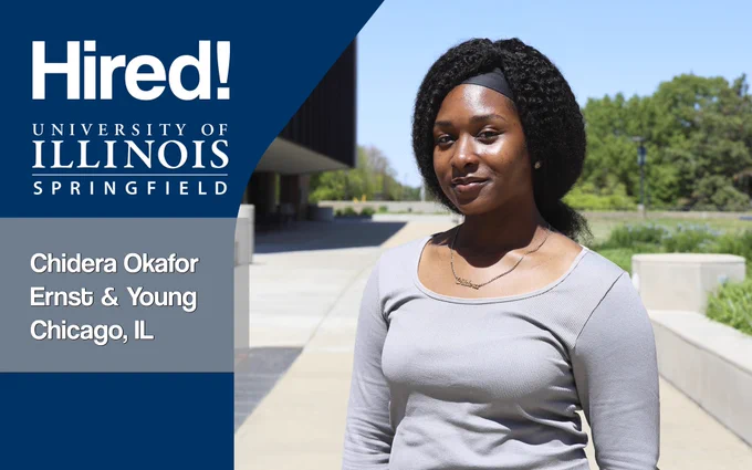 A female student smiling at the camera with greenery and a building in the background. Text reads: “Hired! University of Illinois Springfield, Chidera Okafor, Ernst & Young, Chicago, IL.”