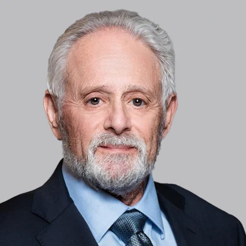 Headshot of Franchise & Distribution Attorney Barry Kurtz on a light gray background. 