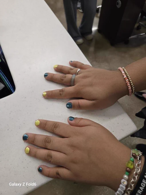 Student shows her festive manicure as she prepares for the Essential Academics prom at VMHS