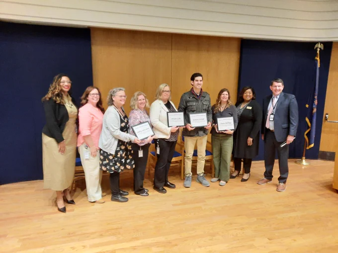 Group photo of MDE staff receiving their 10-year service awards, including Library Law Consultant Clare Membiela and Youth Services Coordinator Cathy Lancaster.