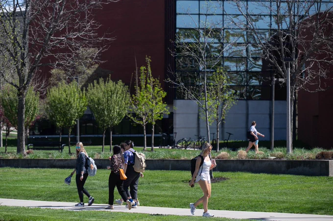Students walking in front of a building.
