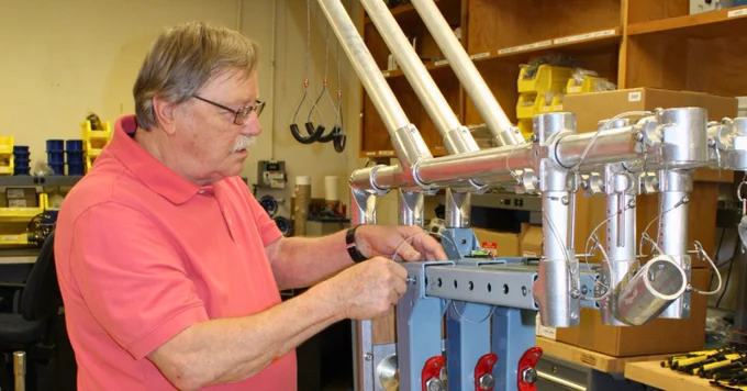 Assembling one of three Rapid Deployment Gage (RDG) mounts. Photo by Joanne Jones, USGS