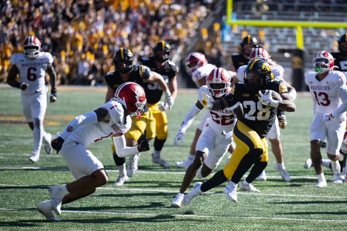 A football game of Iowa vs. Indiana.