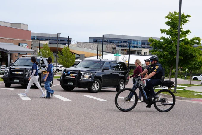 DCSO sergeant riding a bike at the STEM community walk.