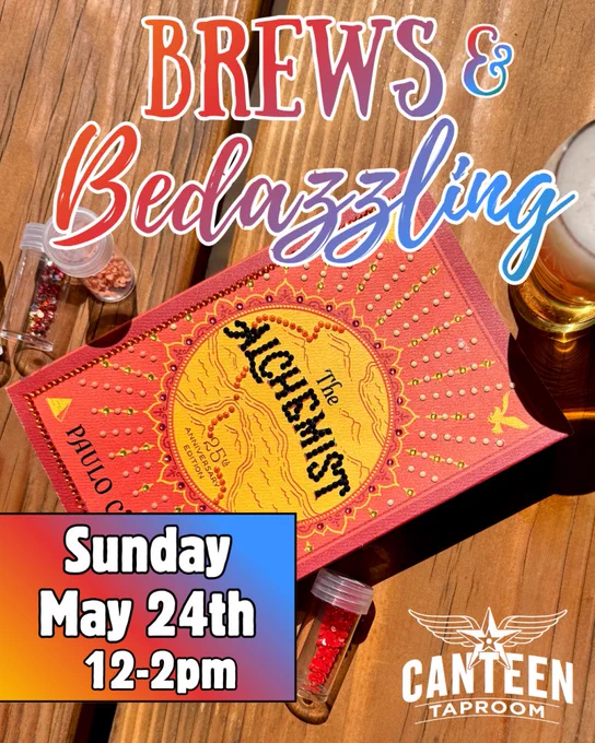 Red edition of The Alchemist book on a wooden table with small jars of beads and a glass of beer nearby, promoting a Brews & Bedazzling event.