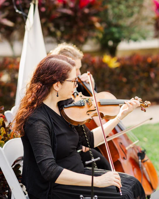 A photo of two people playing the violin and cello for a wedding ceremony at Innisbrook Resort in Palm Harbor, FL.