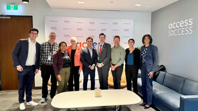 At the ATS Innovation Hub, a group poses together in front of an Access to Success backdrop in a modern meeting space. From left to right: Aaron L. Greenspan, Aidan Tierney from eBay, Mellissa Kuforiji from XYZips, Frances Edmonds from HP Canada, Varun Chandak, Christopher T. Sutton, Accessibility Commissioner, Eric Girard, Safiya Rajwani from Rehab2Go, and Cynthia Mooney from HP Canada.