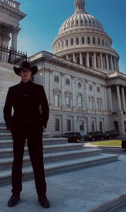 Farmer Josh Young standing in front of a monument in Washington, D.C. 