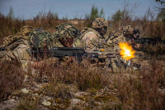 From left, U.S. Army Pfc. Chase Anders, an infantryman, and Spc. Anthony Reyes,  both infantrymen assigned to Echo Troop, 2nd Squadron, 2nd Cavalry Regiment, engage a simulated enemy position during the force-on-force phase of Project Flytrap at Pabrad\u0117 Training Area, Lithuania, May 4, 2026. U.S. Soldiers faced off against British paratroopers from the U.K. Parachute Regiment in a series of simulated engagements designed to test counter-unmanned aerial system integration in a contested environment. From April 27 to May 31, 2026, U.S. and Allied forces will conduct Project Flytrap as part of a series of linked exercises, including Sword 26, Saber Strike, Immediate Response, and Swift Response, which transform experimentation into capability. During Project Flytrap, Soldiers integrate counter-unmanned systems, AI-enabled command and control, and live data networks to move faster, decide faster, and fight more effectively across all domains. (U.S. Army photo by Sgt. Max Elliott)