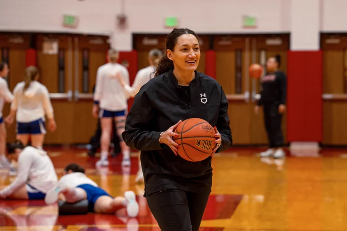 Kourtni Stevenson holding a basketball.