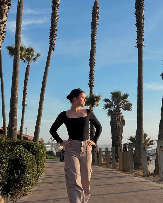 Girl standing on boardwalk