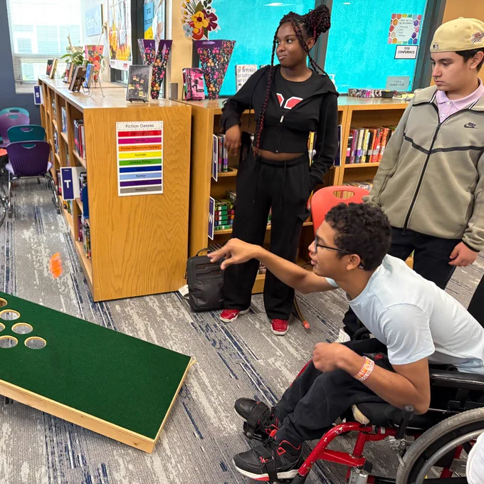Classroom with students of different abilities working to play a game.