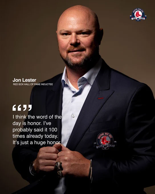 TEXT: “I think the word of the day is honor. I’ve probably said it 100 times already today. It’s just a huge honor.” - Jon Lester
IMAGE: Jon Lester smiles and stands for a portrait wearing his 2007 and 2013 World Series rings and showcasing his navy blue suit jacket with the Red Sox Hall of Fame logo patch.