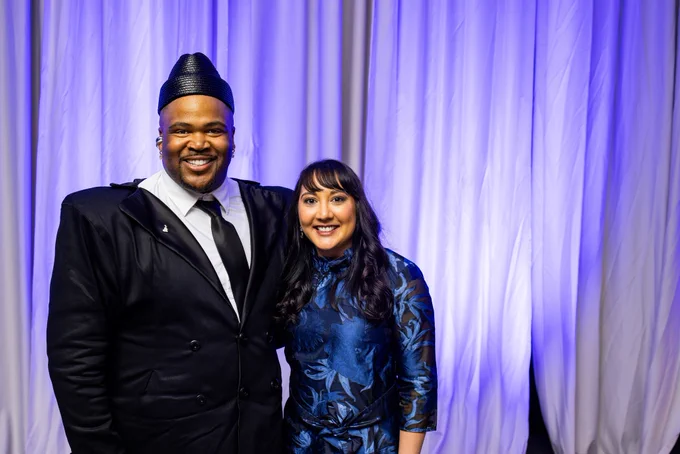 Kameron N. Saunders and Amy Patel pose for a photo together, both smiling.