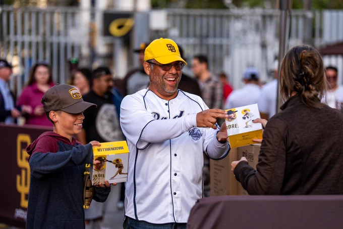 Fans receiving the Mason Miller bobblehead.