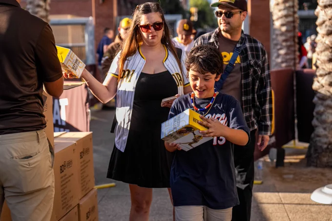 Fans receiving the Mason Miller bobblehead.