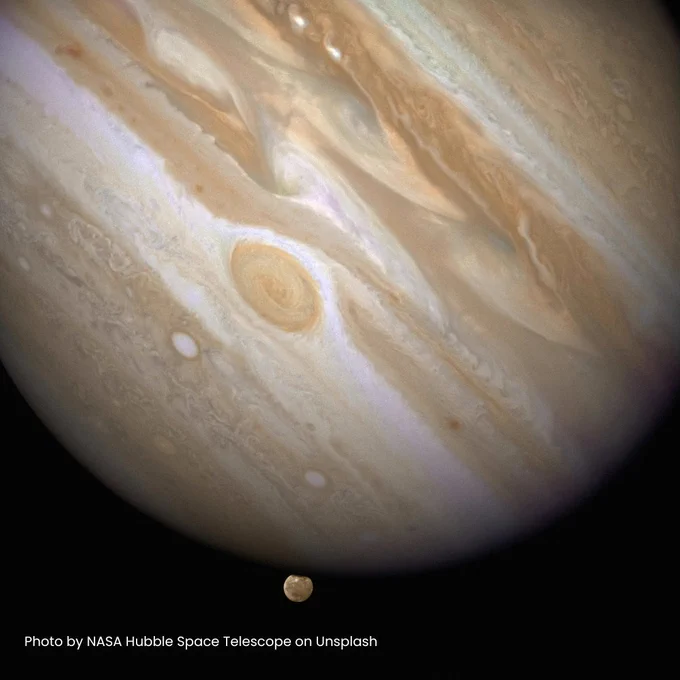 An image of Jupiter & Ganymede taken by NASA's Hubble space telescope.