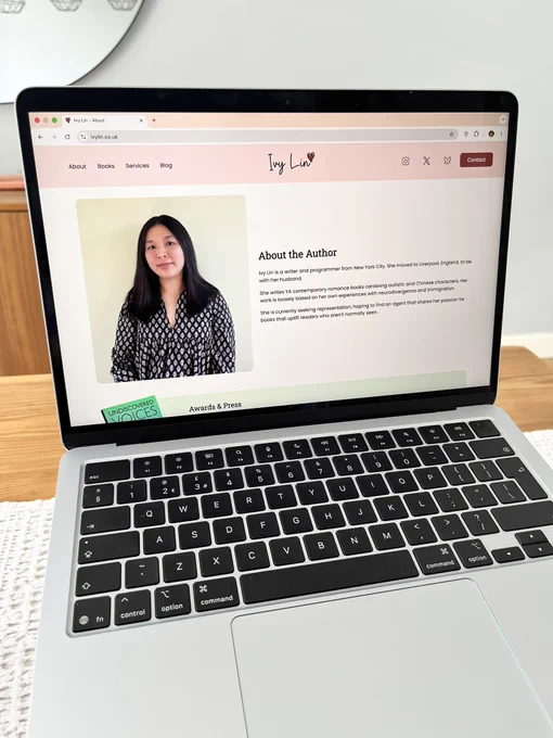 Macbook Air screen showing the homepage of Ivy Lin's website