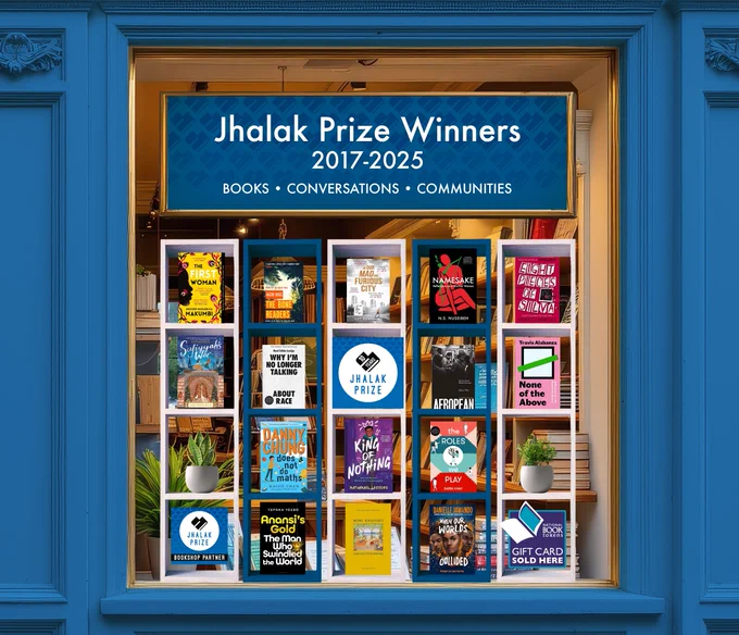 Image of bookshop window with a display of Jhalak Prize winners 2017-2025. Banner on top of the window also carries words: Books, Conversations, Communities