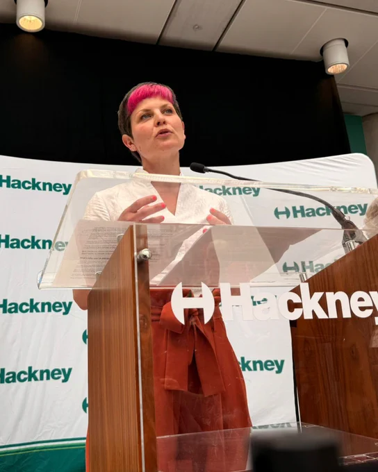 Zoe Garbett speaking in front of the podium