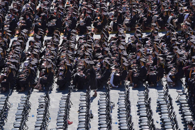 An aerial photo showcases graduates sitting during Commencement at FirstBank Stadium.