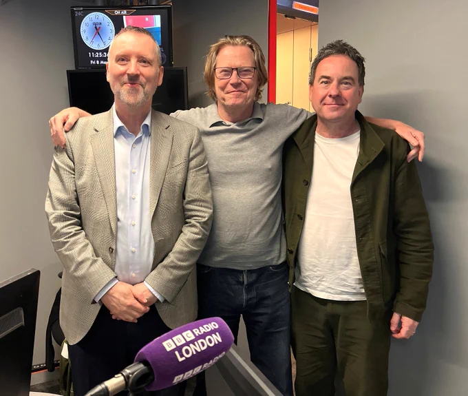 Exhibition curator and former editor of The Sun, Dominic Mohan, and Barbican Music librarian, Richard Jones, pictured by BBC Radio London's Robert Elms shortly after their interview about the '1996' exhibition at the music library.