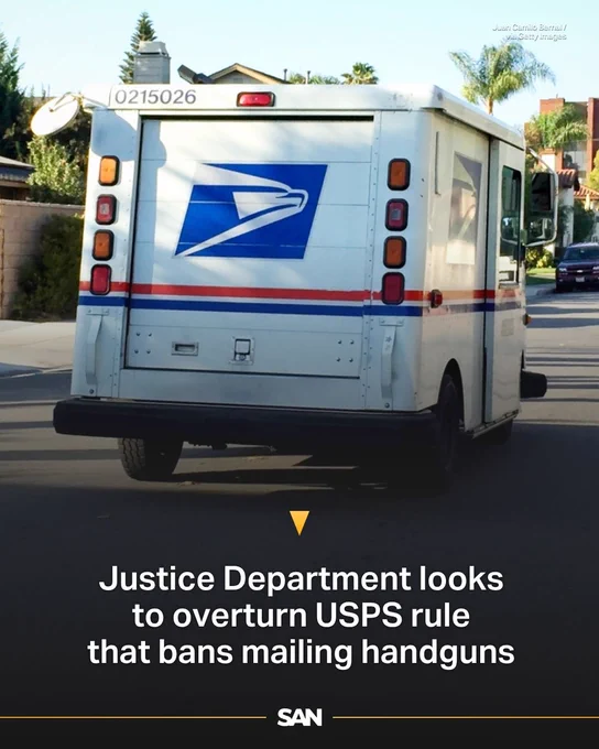 USPS mail truck driving on a suburban street with palm trees in the background.