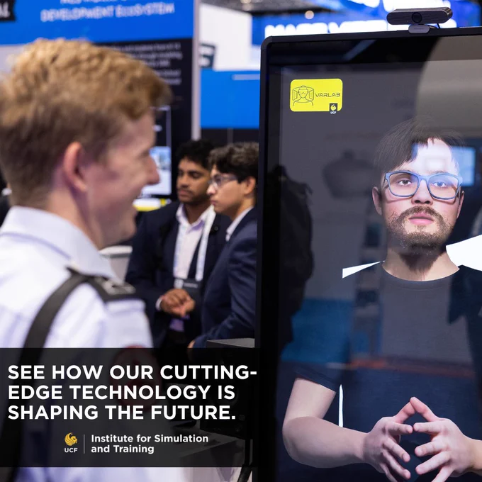 Visitor facing a large screen displaying a realistic virtual avatar at a UCF Institute for Simulation and Training booth.

See how cutting-edge technology is shaping the future