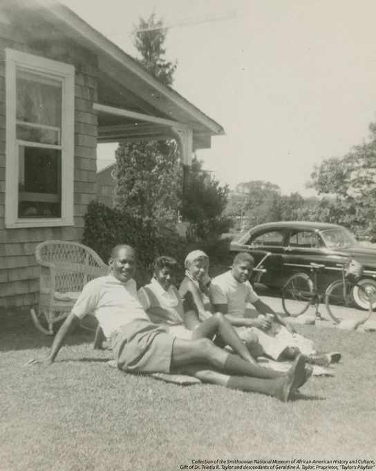 A black-and-white digital image of family members posing outside the Taylor family home on Martha's Vineyard.
