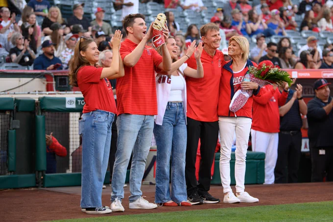 Angels Director of Field/Ground Maintenance Barney Lopas stands on the warning track with his family during his pregame recognition, honoring his 30 years with the Angels and congratulating him on his upcoming retirement.