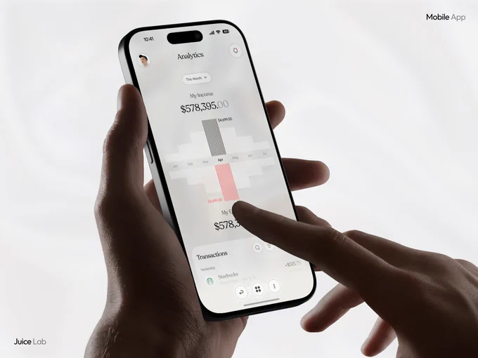 Lifestyle shot of hands holding a smartphone displaying ZIKO fintech app Analytics screen. Shows "My Income $578,395.00" with bar chart breakdown, "My Expenses $578,395.00", and recent transactions including Starbucks. Elegant, modern, and user-friendly mobile financial analytics interface designed by Juice Lab.