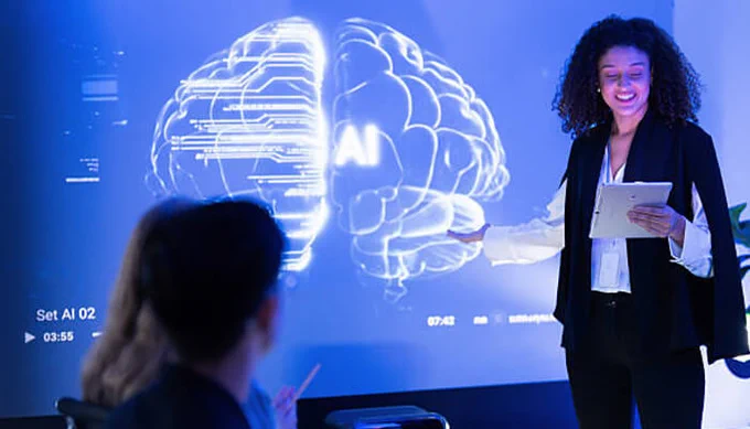 Businesswoman presenting AI-powered brain visualization on a digital screen during a team meeting, demonstrating AI concepts and technology in 2026.