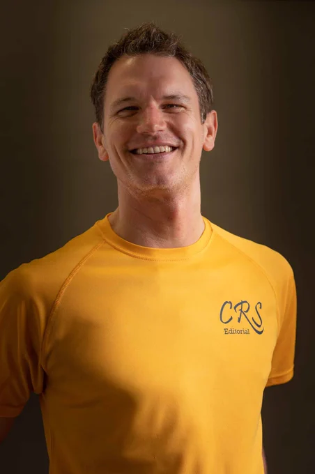 Craig Smith of CRS Editorial in a yellow branded T-shirt.