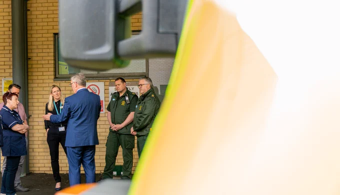Health Minister Mike Nesbitt speaks with Northern Trust healthcare staff and Northern Ireland Ambulance Service members.