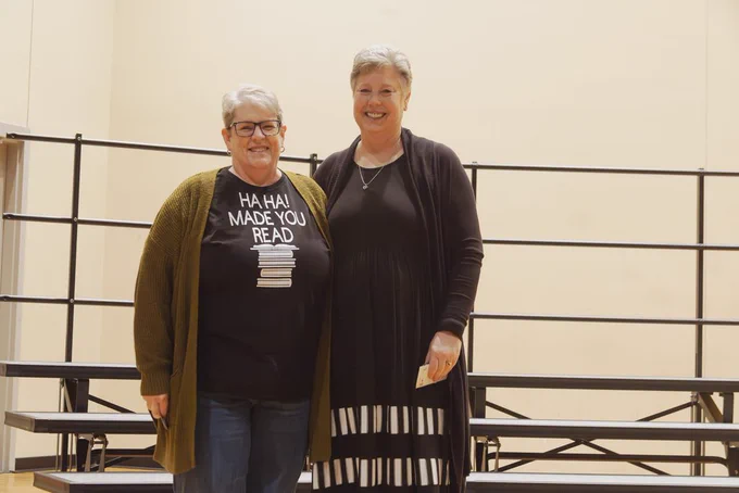Cathy Kwapnioski and Laura Magg following their receipt of their 35 years of service pin.  risers in background located at CHS