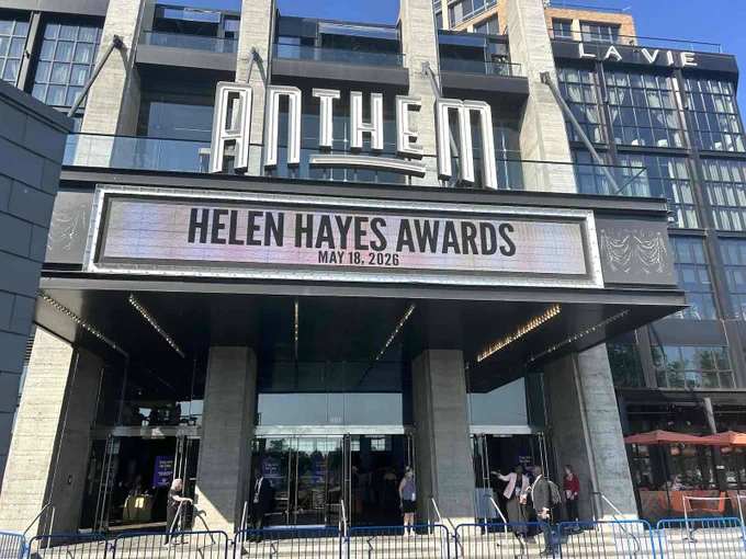 The Anthem venue marquee displays the Helen Hayes Awards event date, May 18, 2026, with people entering the building.