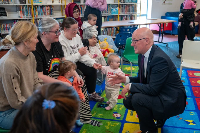 First Minister John Swinney joins Bookbug session at Wester Hailes Library.
