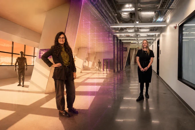 Federica Geremicca and Melissa Bilec in the Mascaro Center with the digital twin landscape on the left merging into the actual structure to the right (photo Thomas Altany)